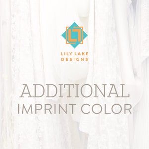 May include: White fabric backdrop with the text "ADDITIONAL IMPRINT COLOR" and a logo for Lily Lake Designs featuring a teal blue diamond with an orange letter L inside.