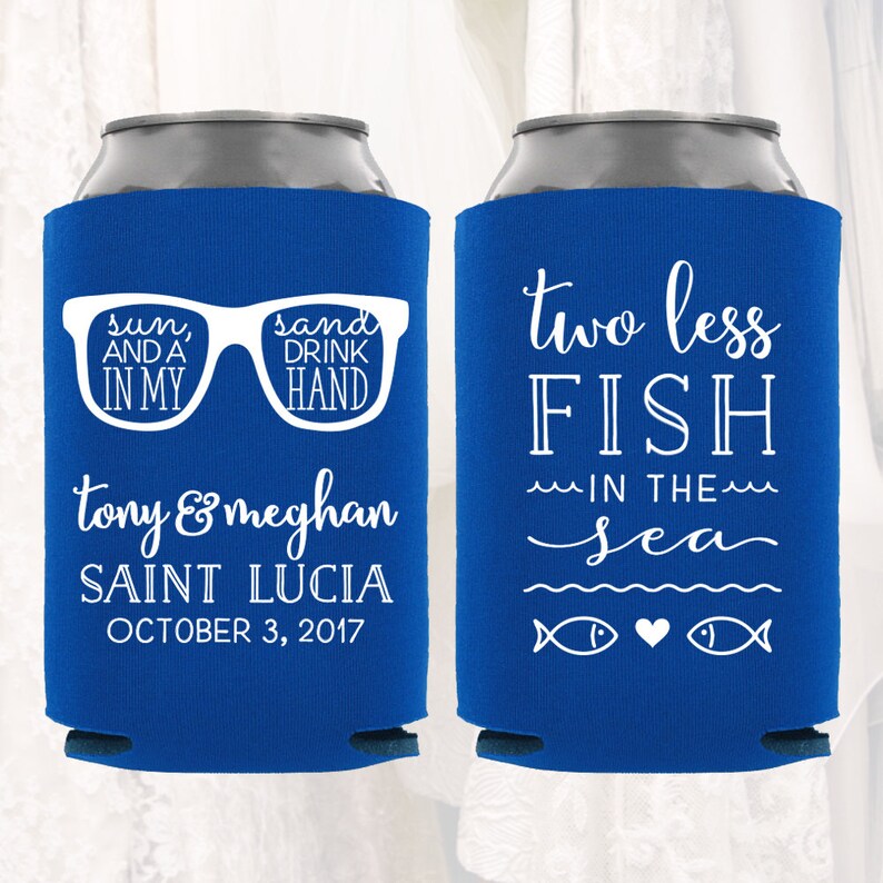 May include: Two blue and white can coolers. One cooler has the text "sun, and a in my sand drink hand" with a pair of sunglasses. The other cooler has the text "two less fish in the sea" with two fish and a heart.