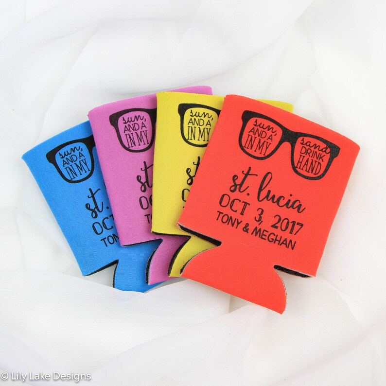 May include: Four colorful can coolers with a design of sunglasses and the text "sun, and a in my" and "sand drink hand". The red cooler has the text "st. lucia OCT 3, 2017 TONY & MEGHAN".