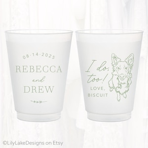 May include: Two frosted plastic cups with green text and illustrations. One cup reads "08.14.2025 REBECCA and DREW". The other cup says "I do, too! LOVE, BISCUIT" with a dog illustration. Wedding themed.