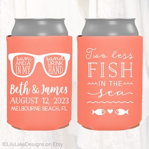 May include: Two coral-colored can coolers with white text. One cooler says "sun, and a in my sand drink hand" and "Beth & James August 12, 2023 Melbourne Beach, FL". The other cooler says "Two less FISH in the sea" with two fish and a heart graphic.