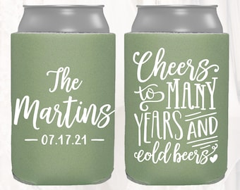 May include: Two green and grey can coolers. One cooler says "The Martins - 07.17.21" and the other cooler says "Cheers to many years and cold beers".