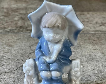 Vintage Blue White Porcelain Boy with Umbrella Figurine Sitting on Fence Mini Statue
