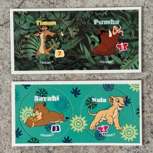 May include: Two sets of Disney Lion King character stickers. The top set features Timon and Pumba, and the bottom set features Sarabi and Nala. Each sticker has a number and a butterfly graphic.