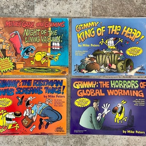 May include: Four comic books featuring a yellow dog character named Grimmy. The titles are "Mother Goose and Grimms Night of the Living Vacuum!" "Grimmy: King of the Heap!" "Grimmy: The Postman Always Screams Twice!" and "Grimmy: The Horrors of Global Worming".