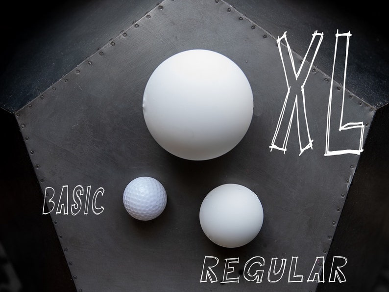 May include: Three white balls of different sizes on a gray background. The largest ball is labeled "XL", the medium ball is labeled "REGULAR", and the smallest ball is labeled "BASIC".