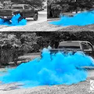 May include: A black pickup truck driving down a paved road with blue smoke trailing behind it. The smoke is a gender reveal announcement, indicating a baby boy. The text "Tori & Jon" is visible in the lower right corner of the image.