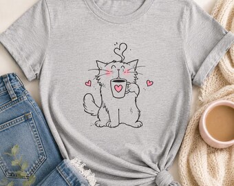Camiseta con un lindo gato sosteniendo una taza / Ilustración de corazón rosa