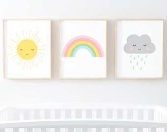 May include: Three framed prints with a yellow sun with a smiling face, a rainbow with pastel colors, and a gray cloud with a smiling face and raindrops.