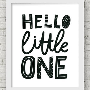 May include: Black and white printable wall art with the text "Hello little one" in a playful, hand-drawn style.