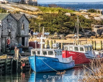 May include: Two fishing boats docked at a pier. The boat in the foreground is blue and white with the text "Miss Peggy Lou" on the side. The boat in the background is red and white with the text "Reminiscence" on the side.