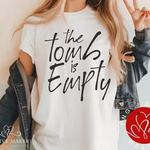 May include: White t-shirt with black text that reads "The house is empty".