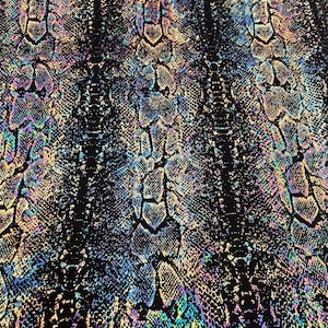 May include: A close-up of a fabric with a snakeskin pattern. The design features a black background with iridescent scales in shades of blue, green, purple, and gold. The scales are textured and detailed.
