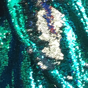 Mermaid flip up sequin shiny emerald green/shiny silverat the other side when it flips  on stretch fabric sold by the yard  {la20fabrics}