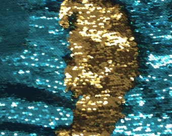 Mermaid flip up sequin shiny turquoise on one side with shiny gold at the other side when it flips  on stretch fabric sold by the yard