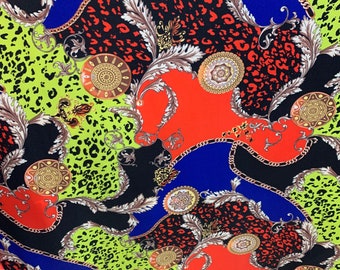May include: A colorful fabric with a repeating pattern of gold chains, leopard print, and ornate designs in shades of red, green, blue, and black.