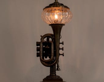 Pocket trumpet accent lamp on vintage brass base.