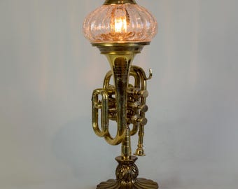 Pocket trumpet accent lamp on vintage brass base.