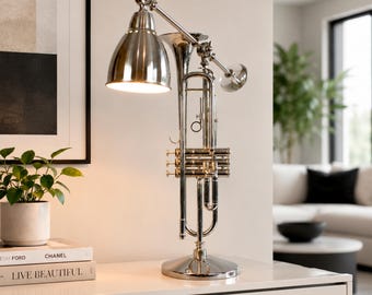 Adjustable nickel-plated modern trumpet lamp.