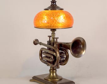 Pocket trumpet accent lamp on solid brass base.