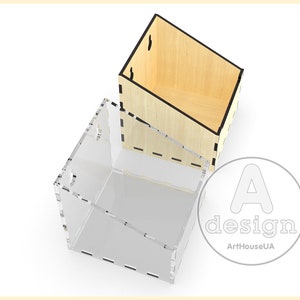 May include: Two boxes, one made of wood and one made of clear acrylic, are stacked on top of each other. The wooden box is light brown and has a black trim. The acrylic box is clear and has a black trim. The boxes are both angled and have a design on the front that says "A design ArtHouseUA".