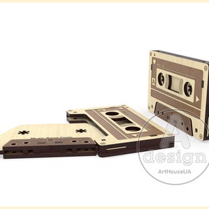 May include: Two wooden cassette tape shaped boxes with the text "Music Song Code" on one and "Audio Tape" on the other. The boxes are made of light and dark wood.