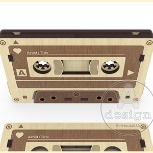 May include: A wooden cassette tape design with a brown top and a light wood body. The cassette has a heart symbol, the letter A, and the words "Artist/Title" on the front.