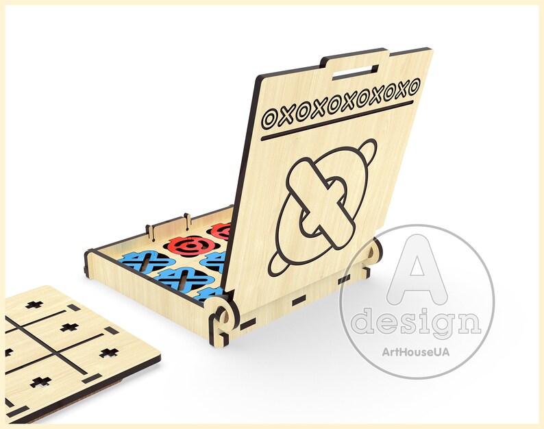 May include: Wooden tic-tac-toe game with a hinged lid that opens to reveal the game pieces. The lid has the text "OXOOXOOXOOXOO" printed on it. The game pieces are red and blue circles and blue and red crosses.