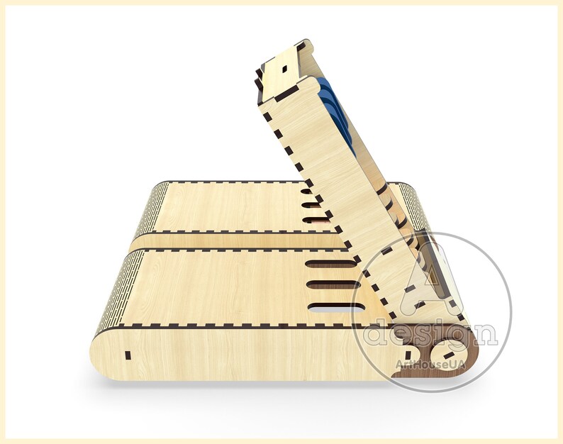 May include: A wooden box with a hinged lid, designed to hold small items. The box is made of light wood with a natural finish and has a decorative pattern on the front. The lid is open and reveals a small compartment inside.