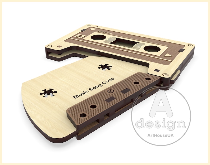 May include: A wooden cassette tape design with the text "Music Song Code" on the front. The cassette is made of two pieces of wood, one brown and one light wood.