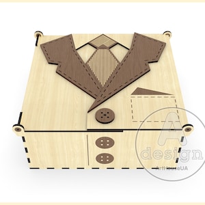 May include: A wooden box shaped like a suit with a brown tie, two buttons, and a pocket on the front. The box is made of light wood and has a dark brown stain.