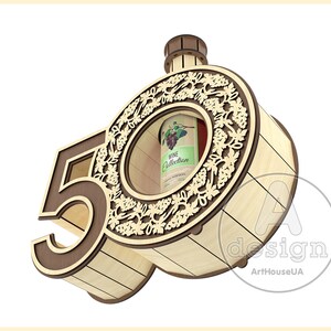 May include: Wooden box shaped like the number 50 with a cutout for a bottle of wine. The box is decorated with a grapevine design and the words "Wine Collection".