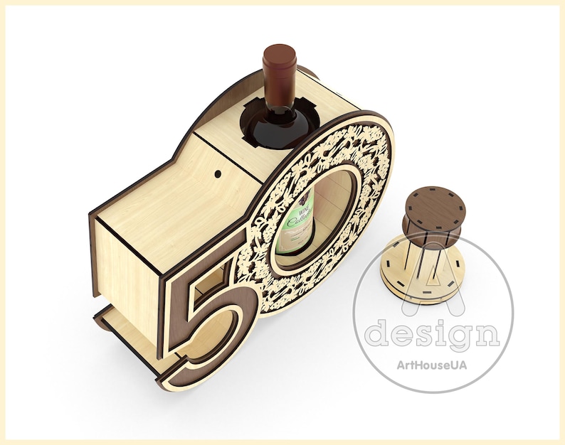 May include: Wooden wine bottle holder shaped like the number 50. The holder is made of light brown wood and has a decorative design around the bottle opening. The holder is designed to hold a standard-sized wine bottle.