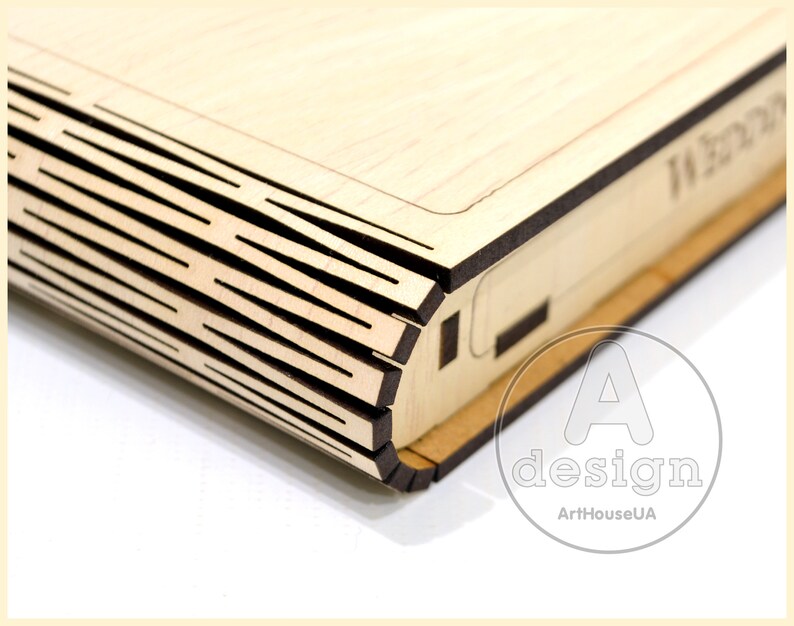 May include: A wooden box with a decorative, layered design on the front. The box is made of light wood and has a dark brown trim.