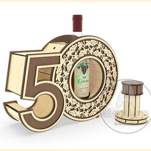 May include: Wooden wine bottle holder shaped like the number 50, with a decorative grapevine design. The holder has a slot for a bottle of wine and a separate compartment for a cork.