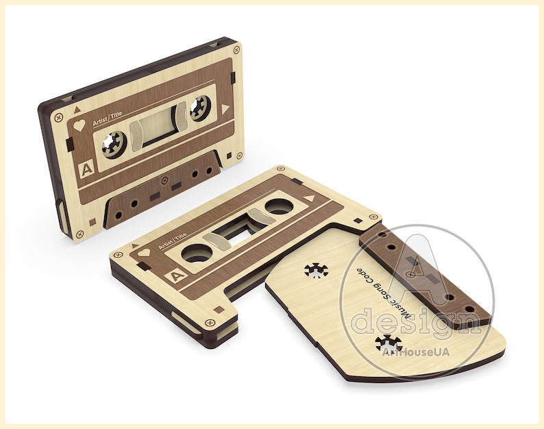 May include: A wooden cassette tape with a brown and beige wood grain pattern. The cassette tape is open and the tape is visible. The cassette tape has the text "Music Song Code design ArtHouseUA" on the side.