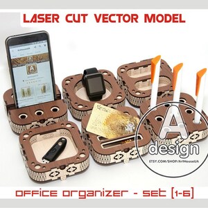 May include: A set of laser-cut wooden office organizers. The set includes compartments for a smartphone, smartwatch, USB drive, pens, and cards. The design features a brown wood finish with decorative cutouts. Text on the image reads "LASER CUT VECTOR MODEL" and "OFFICE ORGANIZER - SET [1-6]"