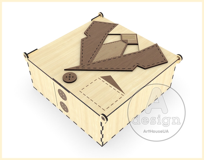 May include: A wooden box with a decorative design of a suit and tie on the lid. The box is made of light wood with brown accents. The box is closed and sitting on a white surface.