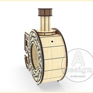 May include: A wooden 50th anniversary cake topper shaped like a train engine with a brown chimney and a decorative design on the side. The train engine is made of wood and has a natural wood finish.