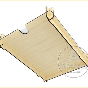 May include: A wooden box with a cutout for a card or photo. The box is made of light wood and has a black outline. The box is tilted at an angle, and the bottom of the box is visible. The text "A design" is printed on the box.
