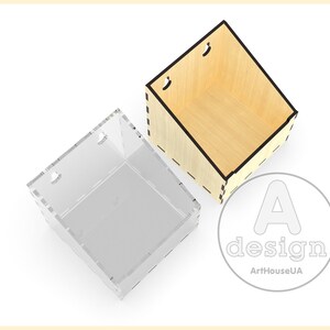 May include: Two empty boxes, one made of wood and one made of clear acrylic. Both boxes are square and have a similar shape. The wooden box has a black outline and the acrylic box has a white outline.
