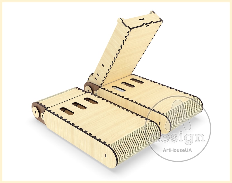 May include: A wooden phone stand with a hinged lid. The stand is made of light wood with a dark brown trim. The stand is open and the lid is propped up.