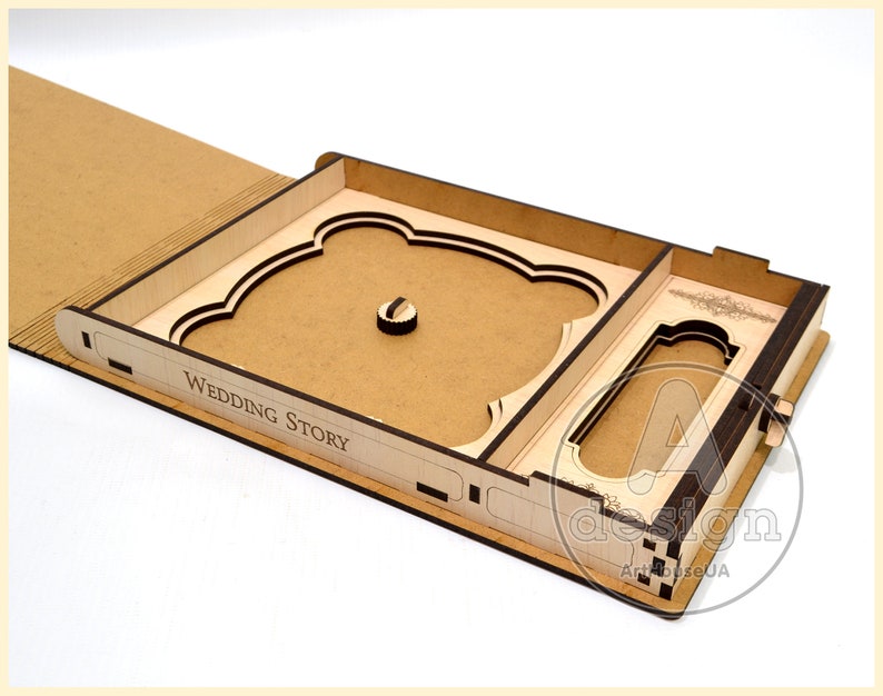 May include: A wooden box with a drawer and a cutout for a photo. The box is open and the drawer is pulled out. The box is labeled "Wedding Story".