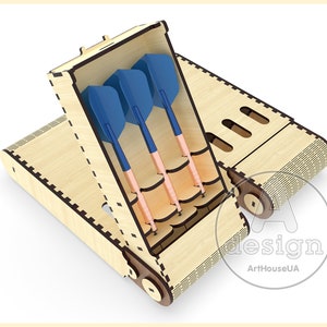 May include: A wooden box with a hinged lid, designed to hold darts. The box has a compartment for storing darts and a slot for holding the dart tips. The box is made of light wood and has a natural finish. The darts are blue and copper.