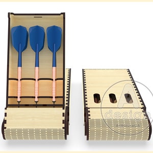 May include: A wooden dart case with a hinged lid, open to reveal three blue and copper darts. The case has a brown wood grain finish and a decorative pattern on the bottom.