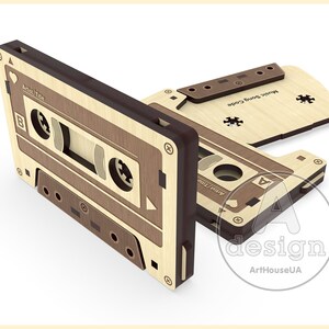 May include: A wooden cassette tape with a brown and beige wood grain pattern. The cassette tape has the text "Actual Time" and "Music Song Code" on it.