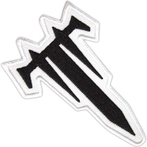 May include: Embroidered patch in black and white. The patch has a striking, angular design with sharp points and a white border. The black shape is symmetrical and geometric. Ideal for customising clothing or accessories such as jackets and bags.