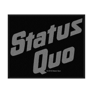 May include: A black rectangular patch featuring the words "Status Quo" in grey, textured lettering. The background has a subtle, patterned design. The copyright notice "© 2018 Status Quo" is displayed at the bottom of the patch.