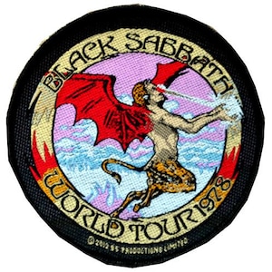 May include: Round patch with the text "BLACK SABBATH WORLD TOUR 1978". It depicts a winged figure with red wings, a tail, and a leopard-print lower body, set against a pink and blue backdrop. The border is black.