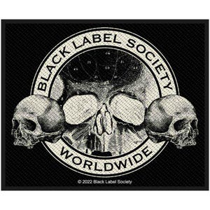 May include: A black and white patch with a skull design. The text "BLACK LABEL SOCIETY WORLDWIDE" is in a circular emblem, with two skulls either side of a central skull. The background is black, with the text "© 2022 Black Label Society".